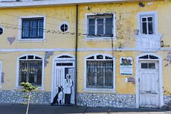 09B Mural Of A Doctor And A Dog At A Door Along Avenida Costanera Waterfront Area Of Punta Arenas Chile.jpg